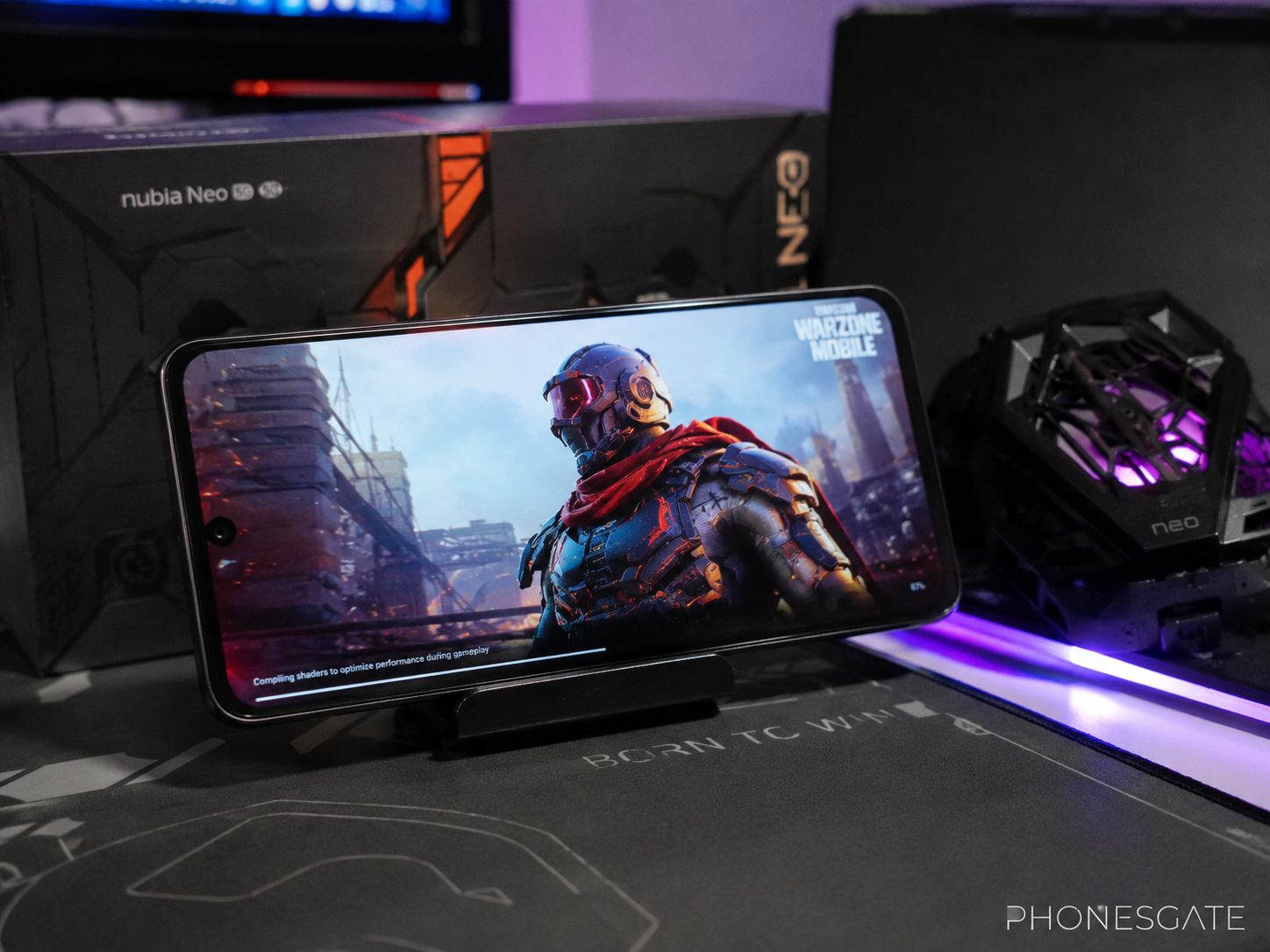 Nubia Neo 5 GT on a dramatic gaming desk scene with subtle PhonesGate branding