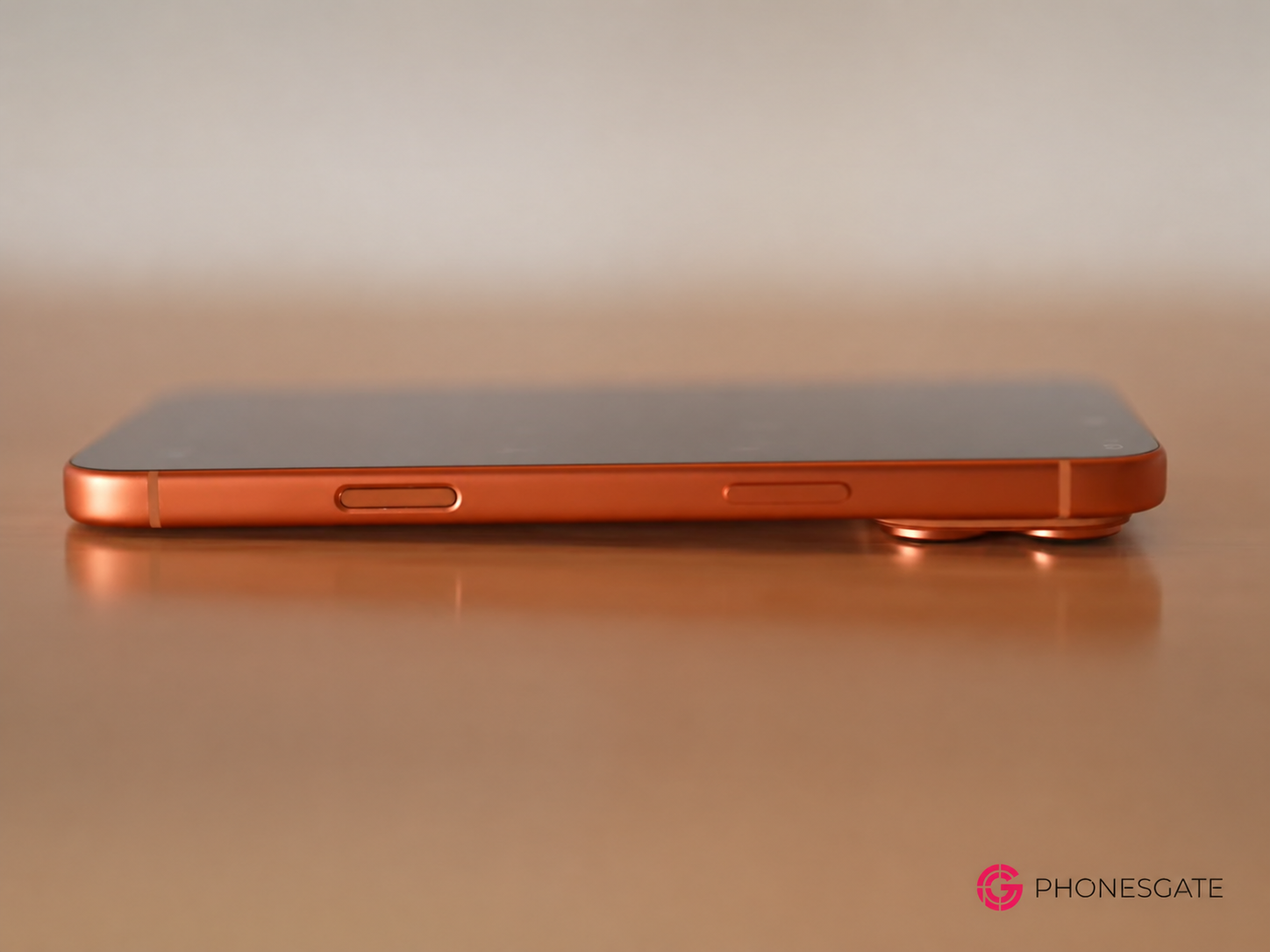 Side profile of an orange iPhone Pro concept