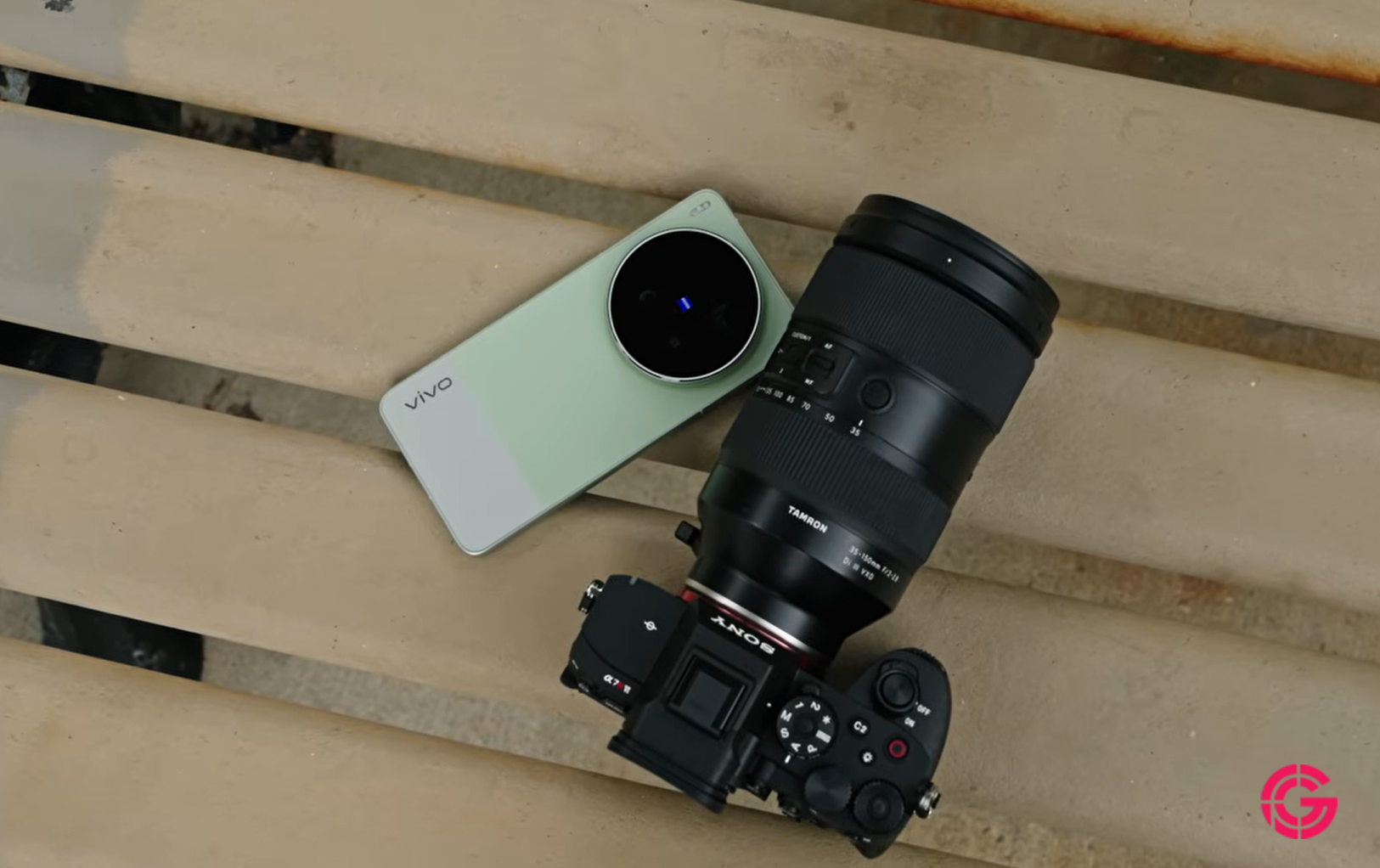Vivo X300 Ultra placed next to a Sony camera on a bench