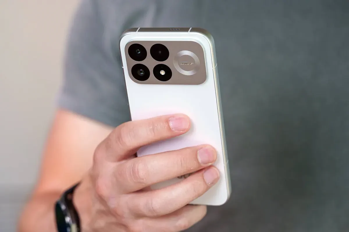 POCO F9 Pro held in hand showing the rear camera design